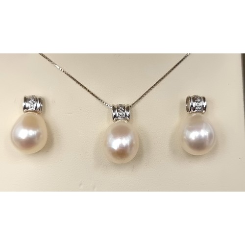 9 - Star Lot: An exquisite example of an 18 carat white Gold Diamond and Natural Pearl suite, comprising... 