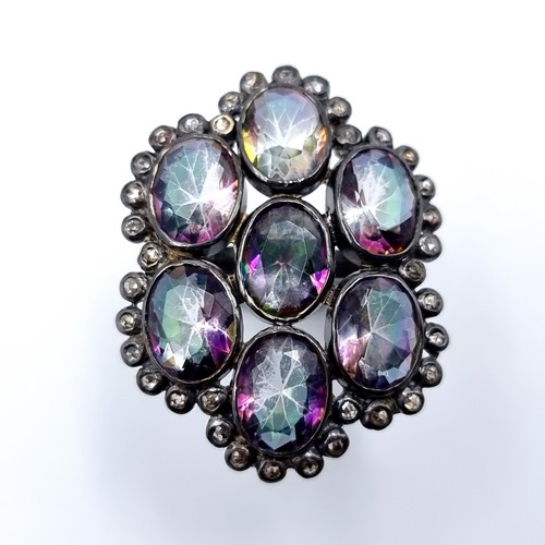 38 - An exquisite Mystic Topaz and Diamond ring, with a beautiful generous seven stone floral design and ... 