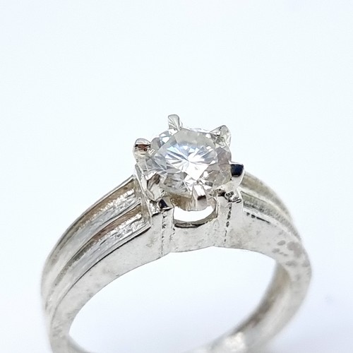42 - A large White Moissanite ring, set in sterling silver. Stone is of 1.1 carats and has a beautiful, b... 