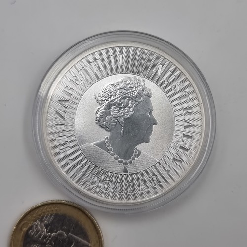 549 - A Queen Elizabeth II Australian Dollar coin, in one ounce .999 fine silver, dated 2020. Set in prote... 