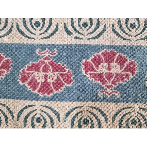 156 - A lovely woven floor rug by Carolyn Donnelly for the 'Ecclectic' collection' features cherry red flo... 