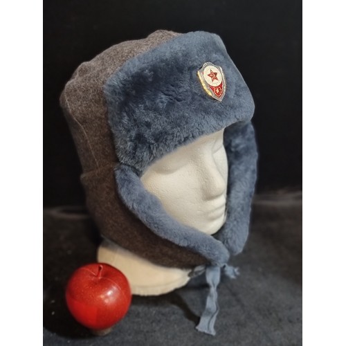 793 - An extra cozy original vintage Soviet Ushanka with enamel pin to front, and brilliant blue fur for c... 