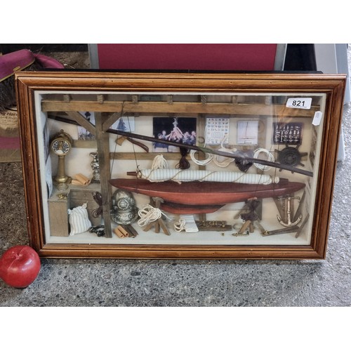 821 - A fantastic and highly detailed naval box frame diorama display, featuring a lifeboat, diving helmet... 