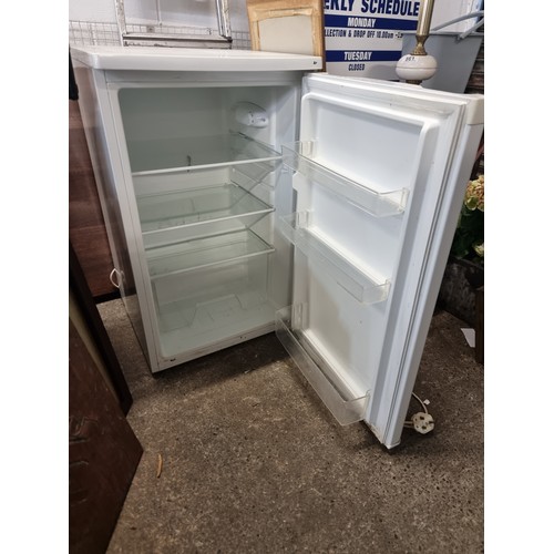 857 - A Belling branded under counter larder fridge with three shelves and storage on doors, capacity of 1... 