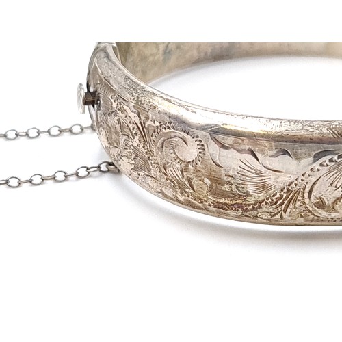 444 - A stunning vintage Sterling silver bangle bracelet with incised foliate ornament dating to 1968 and ... 