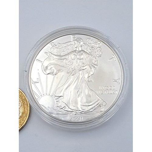 456 - An United States of America one ounce .999 fine silver one dollor coin, dated 2020. Set in protectiv... 