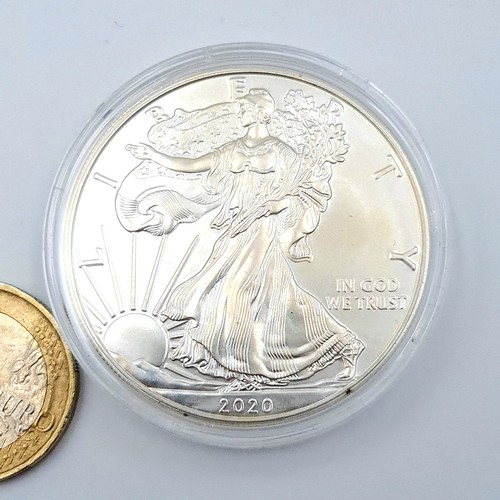 501 - A United States of Amrica one ounce .999  fine silver one dollor coin, dated 2020. Set in protective... 