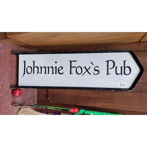 361 - A very cool Johnnie Fox's Pub finger pointer sign in black and white. L105cm x W31cm