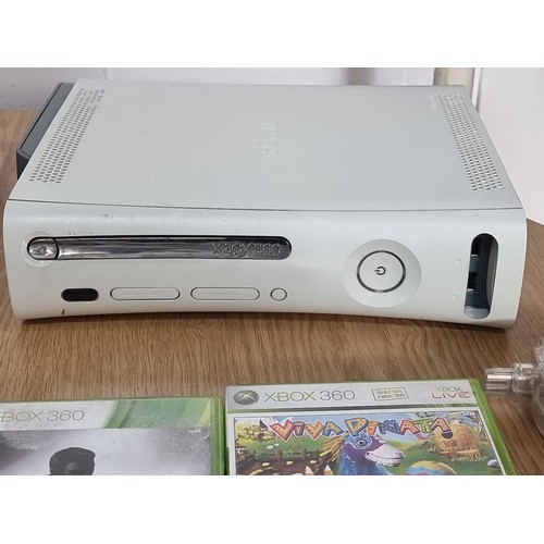 875 - A 60gb Xbox 360 and an original Xbox along with 7 controllers and accompanying cables and two games.... 