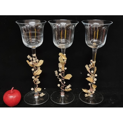 114 - Three new  matching candle holders with long stems and fluted rim. Accentuated by gilt foliate tendr... 