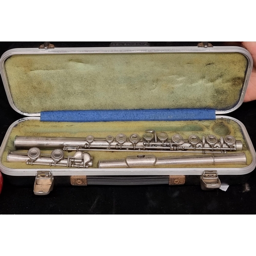 126 - A very nice B&H Bandhite flute in a black hard case.