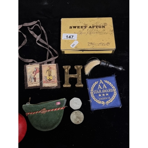 147 - A selection of five vintage items contained within a ''Sweet Afton'' branded cigarette tin. Includin... 