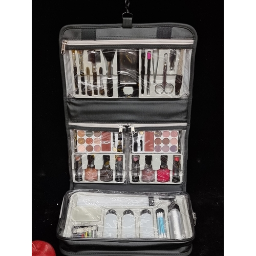 171 - A complete professional make-up travel kit. Brand new and in original cellophane wrap. Including a s... 