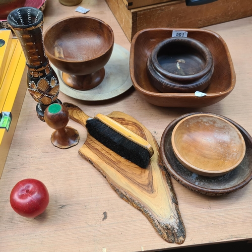 501 - A mixed lot of ten wooden hand carved  items including some lovely carved bowls, a decorative servin... 