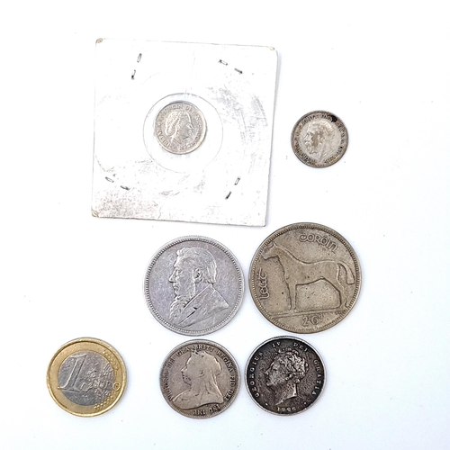 666 - A collection of Sterling Silver coins, consisting of a 1928 Irish half crown (first year of mint), a... 