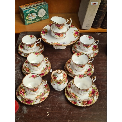 700 - 22 pieces of Royal Albert bone china in the Old Country Rose Pattern. Including a raised cake plate.