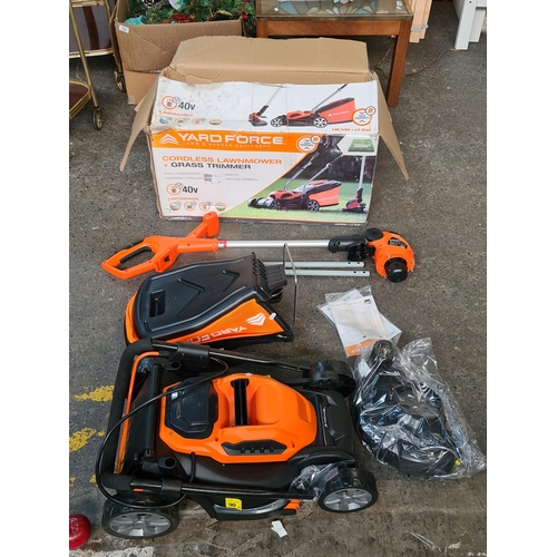 702 - A Yard Force chordless battery powered lawnmower and grass trimmer, never used brand new. Can cover ... 