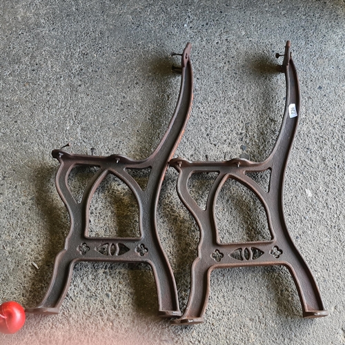 736 - Two antique heavy cast iron bench rests, with a pierced quatrefoil design. Nice age to this lot.