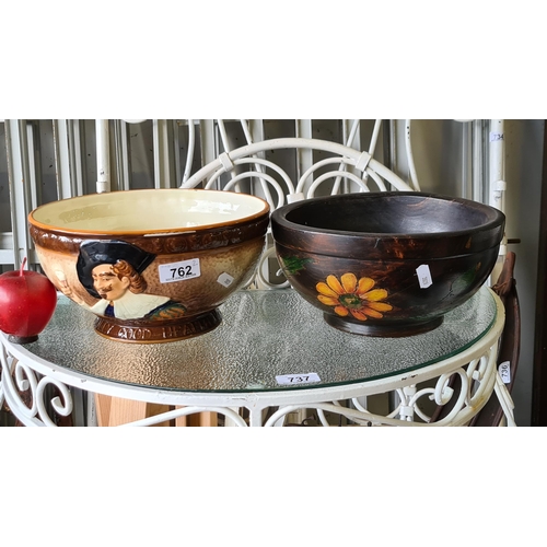 762 - Two large, vintage bowls. One example a turned wooden bowl with hand painted floral motifs. The seco... 