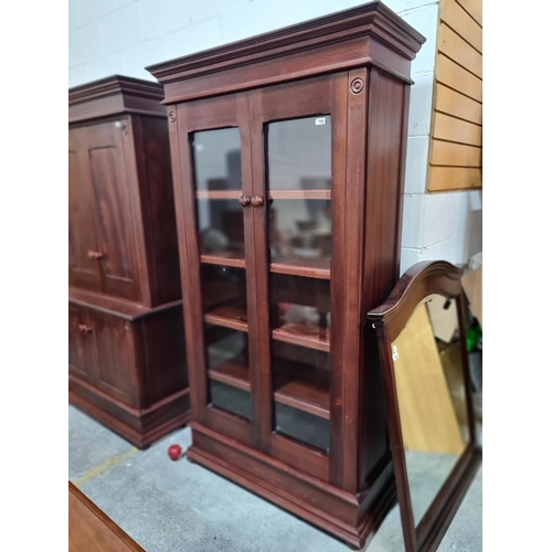 790 - Star Lot : A handsome modern mohagany two door  display case / bookcase. With incised reeded detaili... 