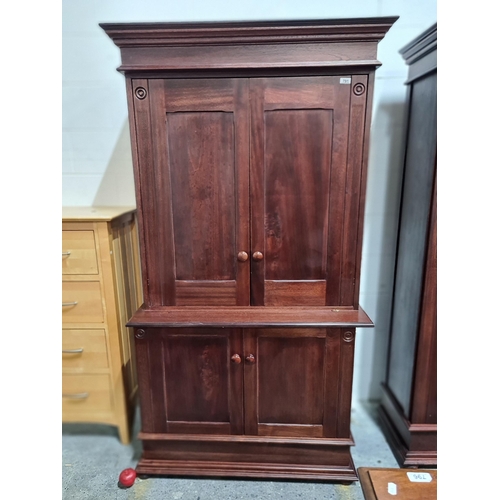 791 - Star lot : A handsome wooden armoire. With incised reeded detailing and a concentric circle motif. F... 