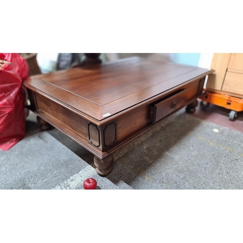 795 - A large example of a large solid mahogany  coffee table. A beautifully crafted piece with large, cur... 