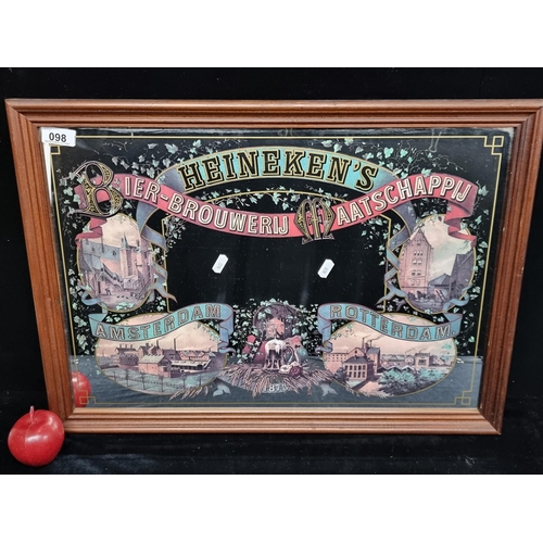 98 - A vintage original mirror advertising Heineken with Dutch city vignettes. Housed in wooden frame. Mm... 