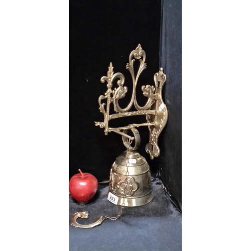 853 - A fabulous wall bell with baroque style scroll ornament to top and inscribed in Latin 