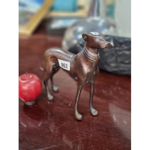 863 - A very striking example of a heavy bronze figure of a Italian greyhound. A very handsome example wit... 