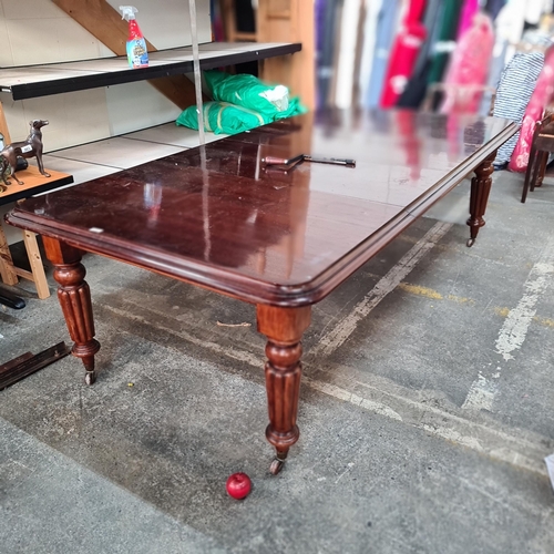 876 - Star Lot : A magnificent example of a Victorian mahogany dining table with two extended leaves and o... 