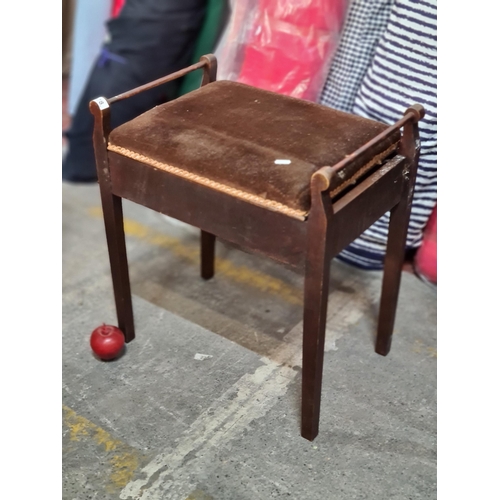 878 - An elegant, Edwardian piano stool. A nice example in mahogany with rich brown upholstery and railed ... 