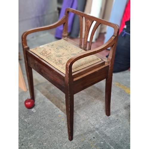 879 - A beautiful Edwardian piano seat. Beautifully carved with sloping rails and central knotwork motif. ... 