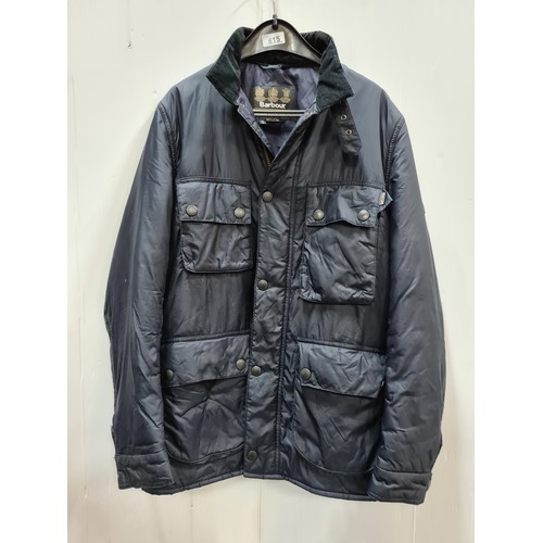 815 - A men's navy coat with a black corduroy collar by Barbour, Manufactures of Waterproof and Protective... 