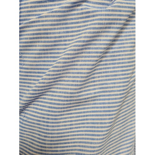 884 - Two large bolts of blue and white pin striped, cotton blend fabric. A quite stiff and durable fabric... 