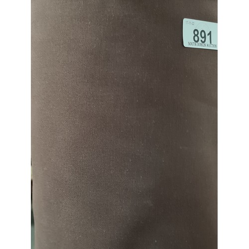 891 - A large bolt of brand new cotton blend fabric with no stretch. In a brown shade and in original plas... 