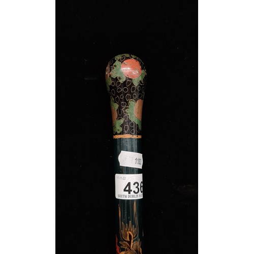 436 - An exceptional example of an ebonised antique walking stick, set with a Japanese swirling traditiona... 