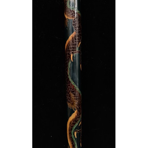 436 - An exceptional example of an ebonised antique walking stick, set with a Japanese swirling traditiona... 