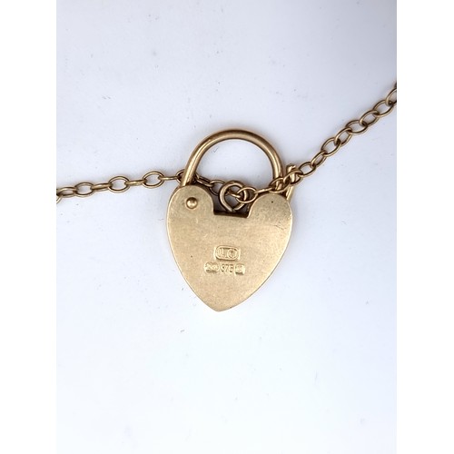 440 - Star lot : A very attractive heavy vintage 9 carat Gold padlock and link chain bracelet. With attach... 