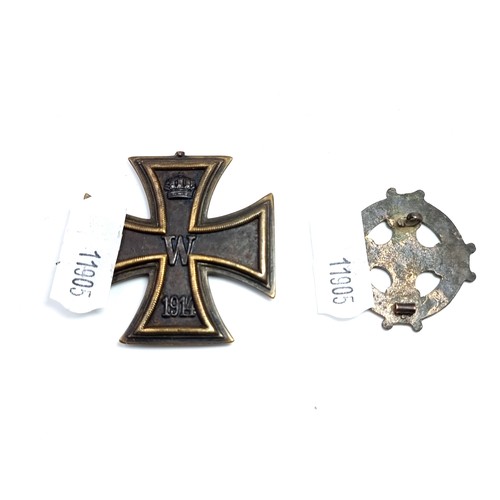 445 - A collection of two pin badges, comprising of a World War II military iron cross of the 1st class. W... 