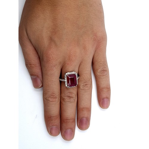 415 - Star Lot: A truly exquisite Ruby and Diamond ring, of 6.5 carats and set with .75 carats of Diamonds... 