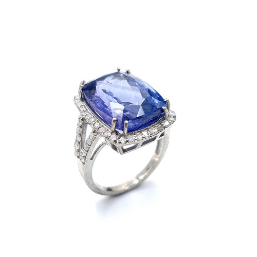 417 - Star Lot: A breath-taking large Diamond and Tanzanite ring, featuring an Oval Cushion cut centre Tan... 