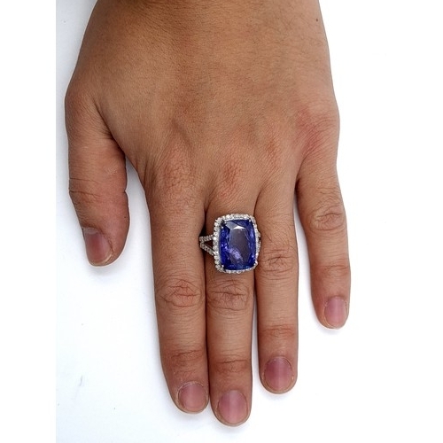 417 - Star Lot: A breath-taking large Diamond and Tanzanite ring, featuring an Oval Cushion cut centre Tan... 