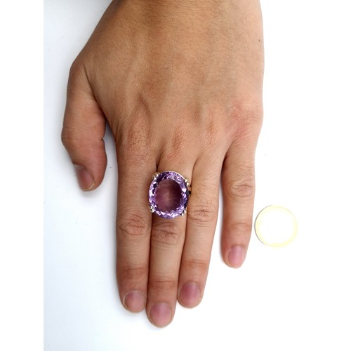 421 - Star lot : A wonderful and brilliant facet cut Amethyst ring, with a fabulous 32 carat striking Amet... 