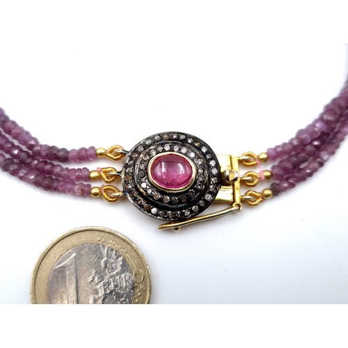 422 - A very elegant three row dusky pink Sapphire, Diamond and Ruby necklace. This piece features graduat... 