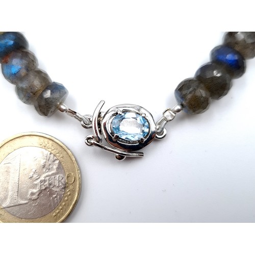 423 - A shimmering natural Labradorite bracelet, with a huge Blue Topaz sterling silver clasp. Beautiful t... 