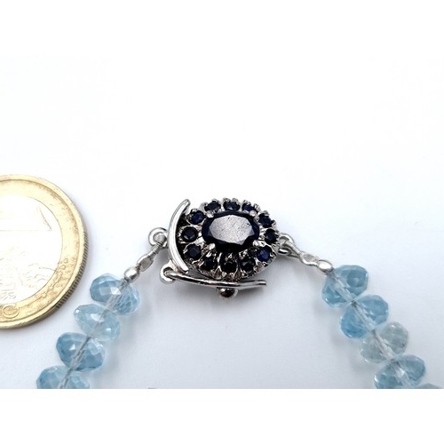 425 - A very attractive Blue Topaz bracelet, of 105 carats and set intricately with a Blue Sapphire sterli... 