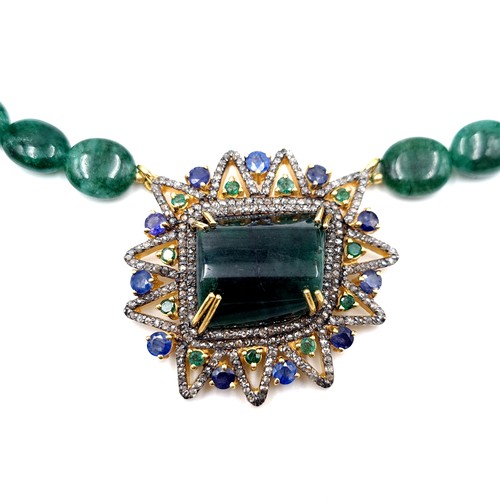 428 - Star Lot : An exceptional Emerald, Diamond and Sapphire necklace, with a striking centre stone of 45... 