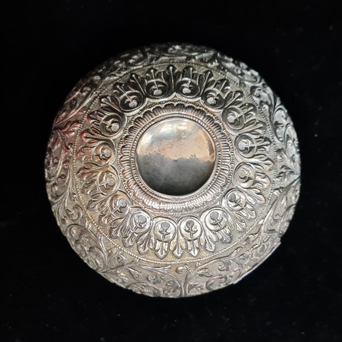 106 - A lovely Indian silver dish with richly embossed, foliate, banded design. H6cm x D11cm. Weight: 116.... 