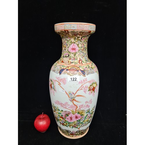 122 - An ornate, large Chinese Famille Rose floor vase, featuring figures in traditional dress and rich fl... 