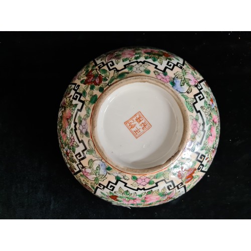 153 - An antique 19th century Chinese porcelain bowl in the Famille Rose palette. Stamped to base in red w... 